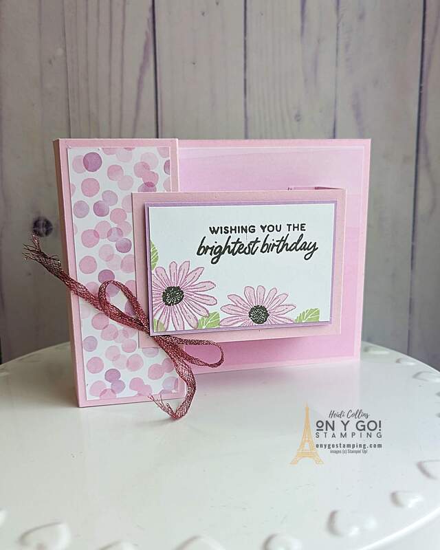 Are you looking for a cheerful card that stands out? The Cheerful Daisies stamp set from Stampin' Up!, along with the Bright and Beautiful DSP, is just the thing for creating a beautiful double-box fun fold card. The daisy design pairs beautifully with the bright colors found in the DSP to create a unique and cheerful card that will put a smile on any recipient's face!