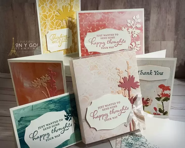 Handmade gift idea for a note card set. These beautiful floral note cards using the NEW Meadow dies, Fine Art Floral patterned paper, and the Happy Thoughts stamp set from Stampin' Up! The note cards tuck into a matching gift box.