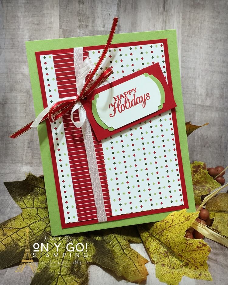 Christmas card making idea with the Heartwarming Hugs patterned paper and Poinsettia Petals stamp set from Stampin' Up! The Label Me Fancy punch makes this card quick and easy to make. 