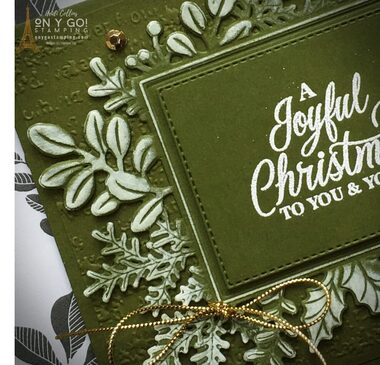Brush an embossed die-cut piece with white ink to create a snow-kissed look on a handmade Christmas card with the Merriest Moments bundle from Stampin' Up!