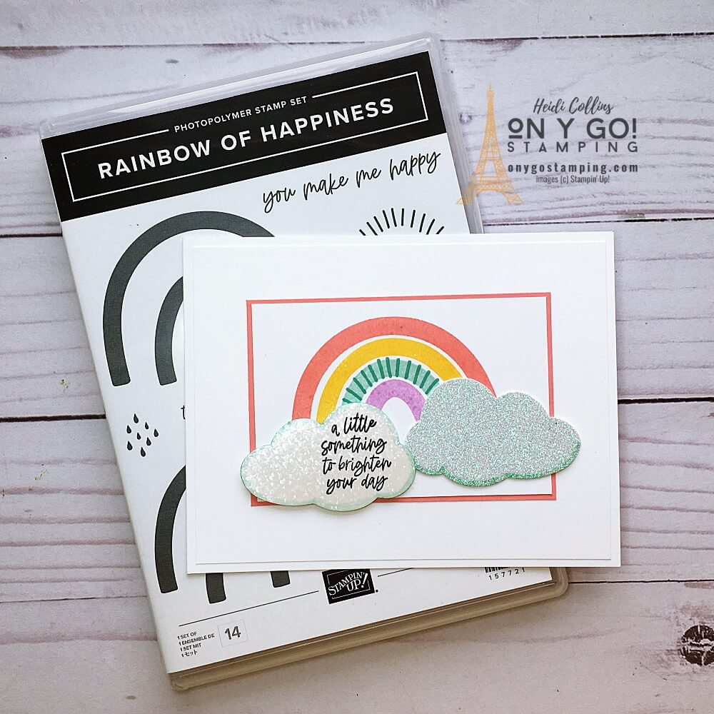 Handmade card idea using the Rainbow of Happiness stamp set from Stampin' Up! This clean and simple card has sparkly rainbows punched from specialty paper with the cloud punch.