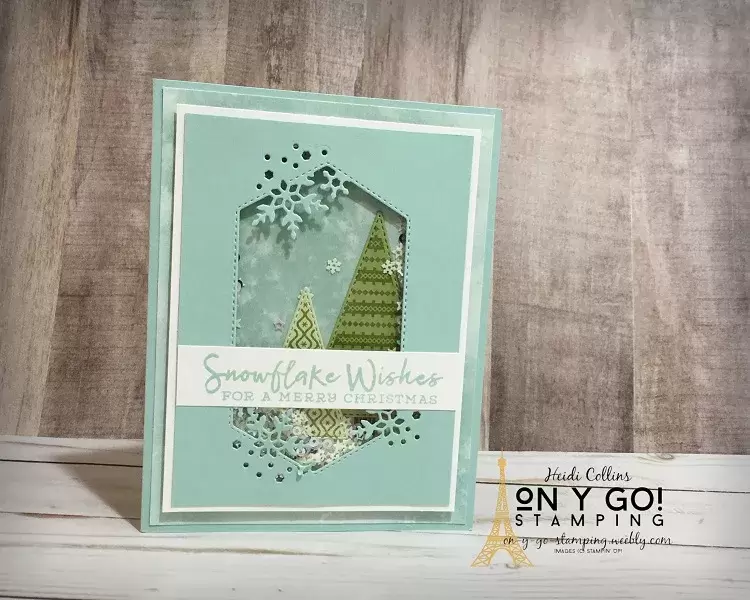 Watch the snow fall on a pair of simple Christmas trees on this fun holiday shaker card. This card is made with the Snowflake Wishes stamp set, Snowflake Splendor patterned paper, and Tree Angle stamp set from Stampin' Up!